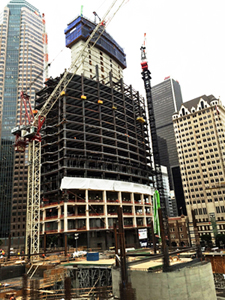 Construction of the Wilshire Grand in Los Angeles, showing exposed metal studs and framing.